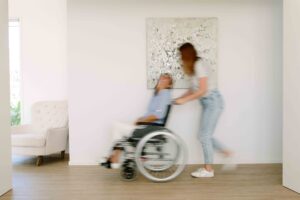 Daughter pushing her mother in a wheelchair